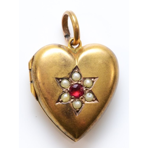 79 - An Edwardian 9ct gold heart shaped locket pendant, with pearl and red paste flower detail to the fro... 