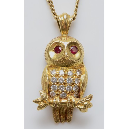 84 - An 18ct gold brilliant cut diamond and ruby pendant in the shape of an owl on a 9ct gold chain, make... 