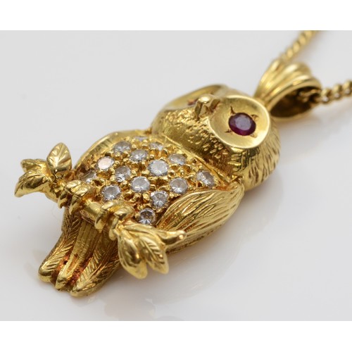 84 - An 18ct gold brilliant cut diamond and ruby pendant in the shape of an owl on a 9ct gold chain, make... 