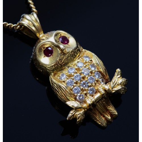 84 - An 18ct gold brilliant cut diamond and ruby pendant in the shape of an owl on a 9ct gold chain, make... 