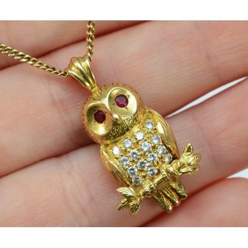 84 - An 18ct gold brilliant cut diamond and ruby pendant in the shape of an owl on a 9ct gold chain, make... 