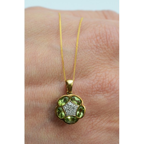 96 - A 9ct gold peridot and diamond cluster pendant with chain, floral shape, 12mm diameter, 2.3g