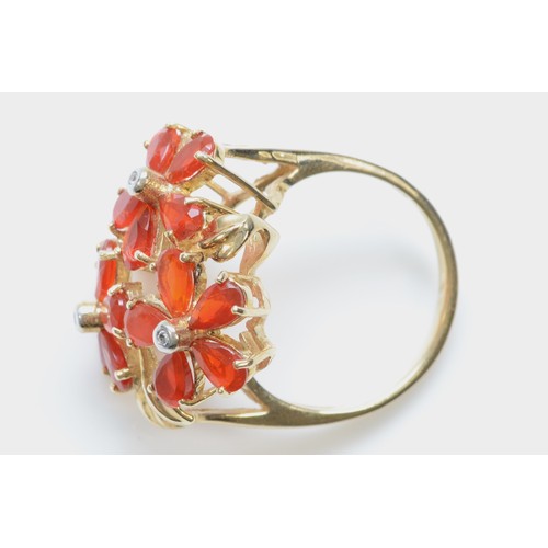 134 - A 9ct gold fire opal and diamond floral dress ring, ring measures 23mm across the front, N, 4.9g