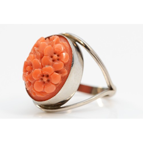 136 - An 18ct gold carved floral coral dress ring, ring front is 18mm top to bottom, J, 6g