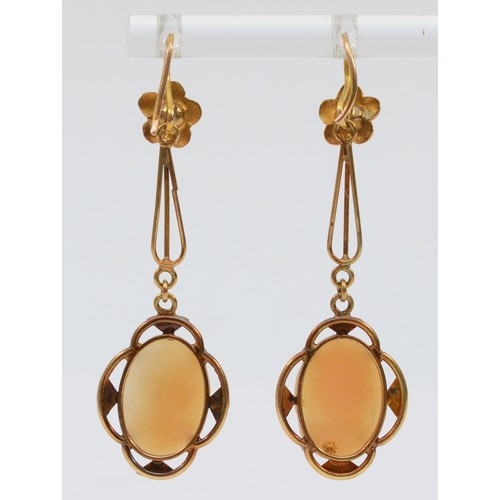 138 - A pair of unhallmarked 9ct rose gold Edwardian shell cameo ear pendants, 50mm total length, 4.3g