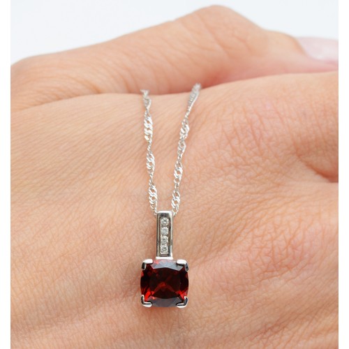 146 - A 9ct white gold garnet and diamond pendant with twist chain, 7mm x 7mm garnet, 15mm total drop, 3.0... 