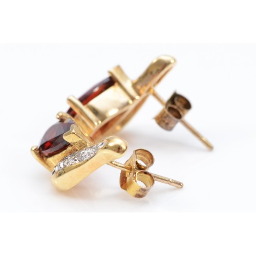 147 - A pair of 9ct gold pear cut garnet and diamond stud earrings with scroll backs, 15mm total drop, 7mm... 