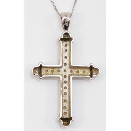 162 - A 9ct white gold diamond cross pendant with chain, 30mm cross length, 3.5g