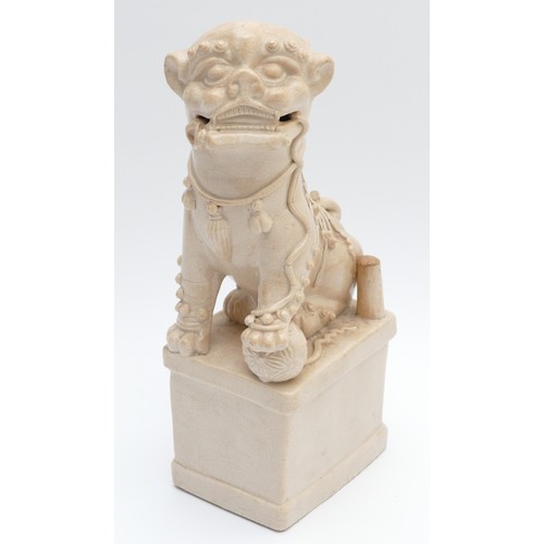 323 - A Chinese blanc de chine figure of a Dog of Fo, late 19th/early 20th century, modelled seated with i... 