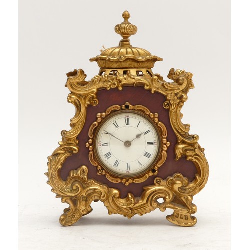 359 - A French 20th century gilt metal and burgundy leather time piece, with ornate mounts, the case numbe... 