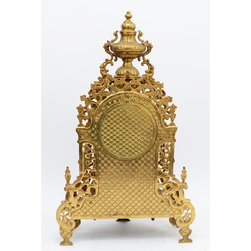 365 - A 20th century large and ornate brass mantel clock, with heavy floral case and vase surmount, the Ge... 