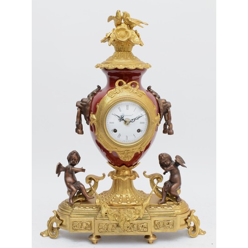 366 - Imperial, an Italian large gilt brass, bronzed and burgundy urn mantel clock, with love birds in a n... 