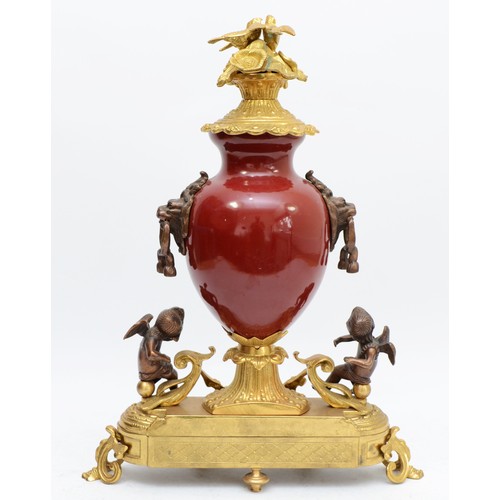 366 - Imperial, an Italian large gilt brass, bronzed and burgundy urn mantel clock, with love birds in a n... 