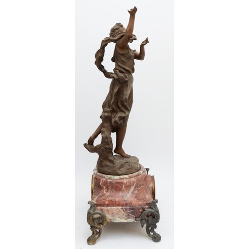 367 - A late 19th century French figural mantel clock, the dial set in a rose mottled marble body, raised ... 