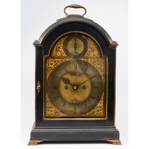 John Gowerth, Oxford, an ebonised striking bracket clock, circa 1700, 7-inch square brass dial with a Roman numeral silvered chapter ring, matted dial centre with winding holes, date aperture, floral spandrels, strike/non strike selection above 12 and signed John Gowerth and Oxford below 12, case with a brass carrying handle, side pierced brass panels,  with pull repeat cord to the right hand side, bracket feet,  four pillar twin fusee movement, hour rack striking on a bell, pull quarter repeat mechanism working, movement backplate elaborately engraved throughout with floral decoration and numbered 467, key, 46cm with handle raised.
Working when catalogued.
Brian Loames records John Goweth, Oxford, born 1669 as does G.H. Baillie, Brittain records John Gowerth, Oxford, c.1701.