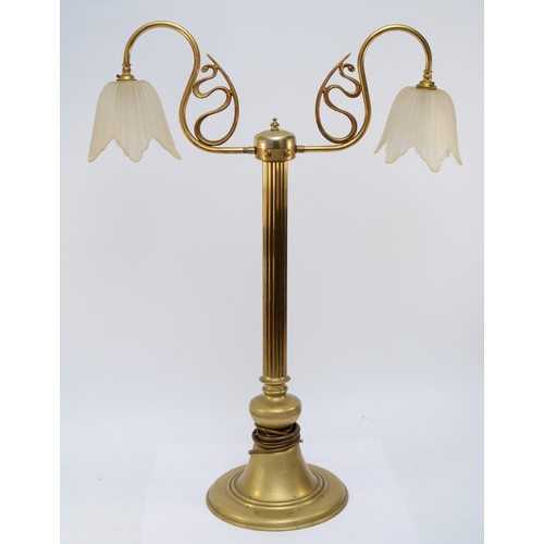 383 - A brass two light table lamp, raised on a fluted column, 77cm