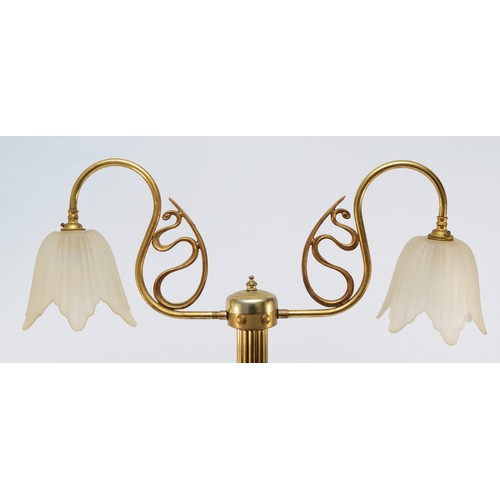 383 - A brass two light table lamp, raised on a fluted column, 77cm