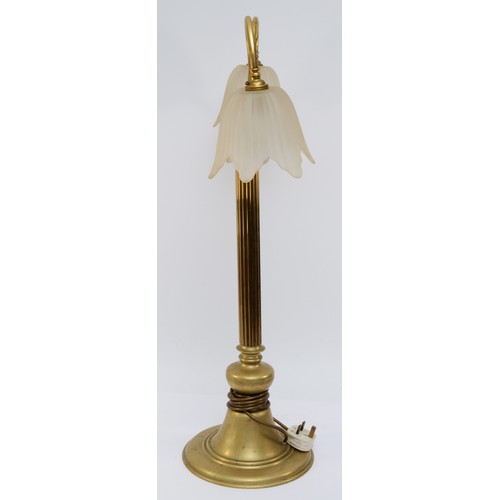 383 - A brass two light table lamp, raised on a fluted column, 77cm