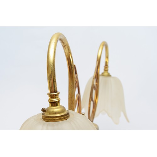 383 - A brass two light table lamp, raised on a fluted column, 77cm