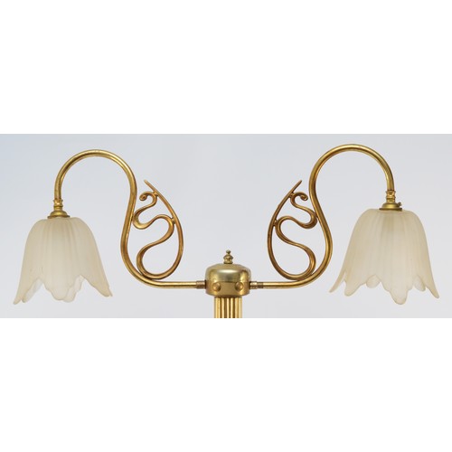 383 - A brass two light table lamp, raised on a fluted column, 77cm