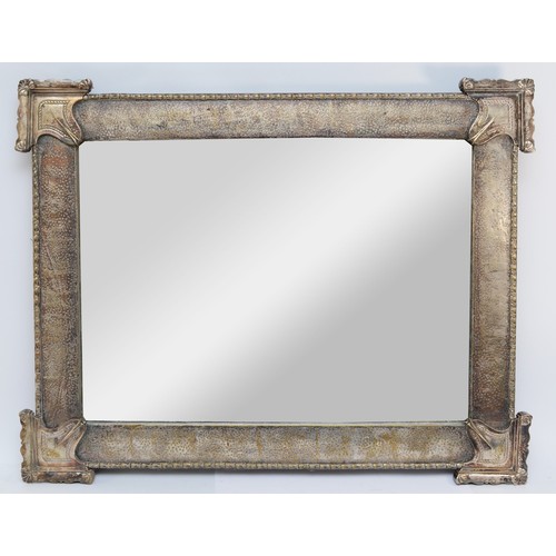 385 - An early 20th century electroplated wall mirror, bevelled edged glass with a hammered finish frame, ... 