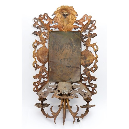 386 - A 20th century cast brass three light wall mirror, with masks above and below, lacking wiring, 60 x ... 