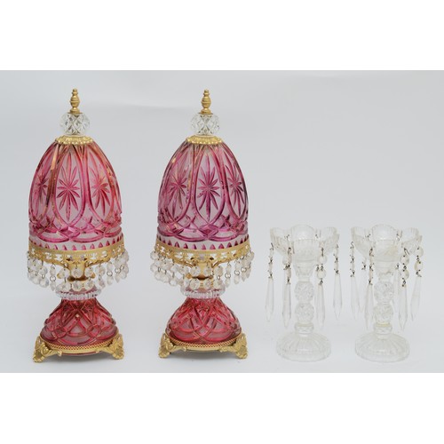 388 - A pair of ruby cut glass lamps, with gilt mounts and lustre drops, 41cm, together with a pair of cle... 