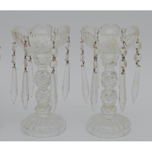 388 - A pair of ruby cut glass lamps, with gilt mounts and lustre drops, 41cm, together with a pair of cle... 