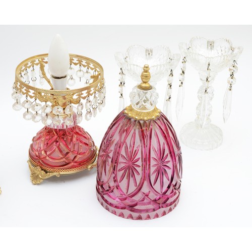 388 - A pair of ruby cut glass lamps, with gilt mounts and lustre drops, 41cm, together with a pair of cle... 