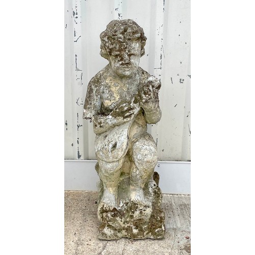 417 - A reconstituted stone garden statue of a boy playing a mandolin, 98cm