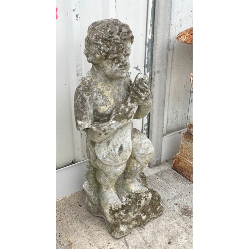 417 - A reconstituted stone garden statue of a boy playing a mandolin, 98cm