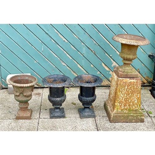 427 - A pair of small cast iron campana garden urns, 32cm, a cast iron urn, raised on a pedestal base, 65c... 