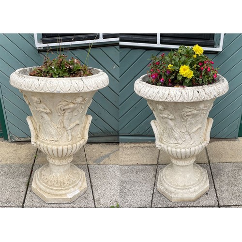 429 - A large pair of reconstituted stone two handle campana urns, decorated with men and woman, 82cm