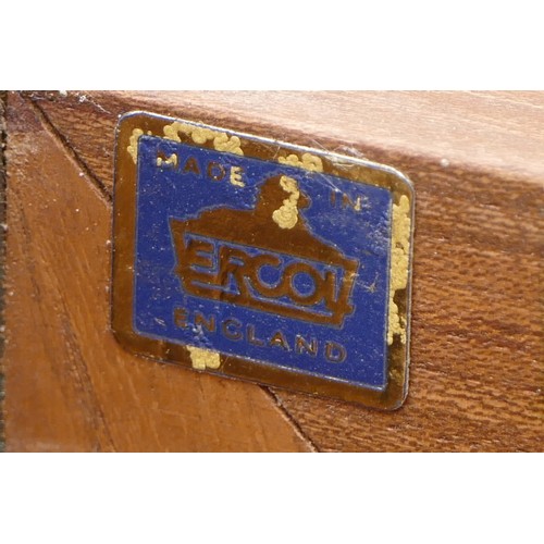 433 - An Ercol blond elm Windsor sideboard, model No. 455, having three central drawers flanked by cupboar... 