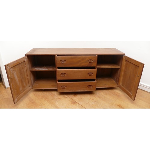 433 - An Ercol blond elm Windsor sideboard, model No. 455, having three central drawers flanked by cupboar... 