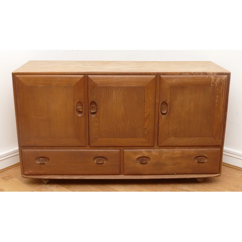 434 - An Ercol blond elm Windsor sideboard, model 429, with a two-door cupboard and adjustable shelf, anot... 