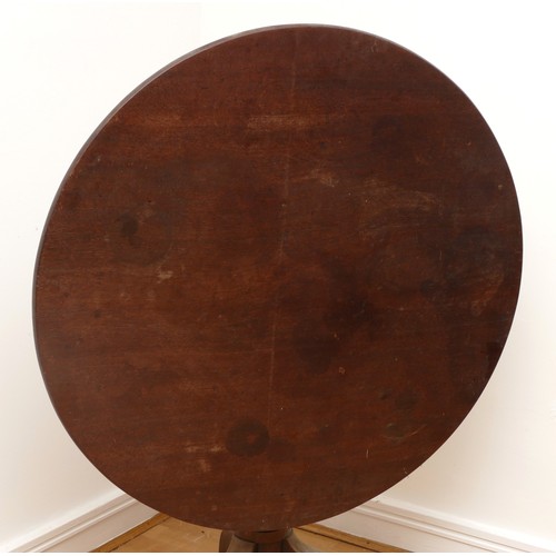 440 - A 19th century mahogany tilt top tea table, the circular top on vase turned column, with tripod cabr... 