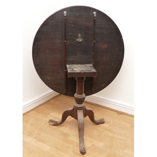 440 - A 19th century mahogany tilt top tea table, the circular top on vase turned column, with tripod cabr... 