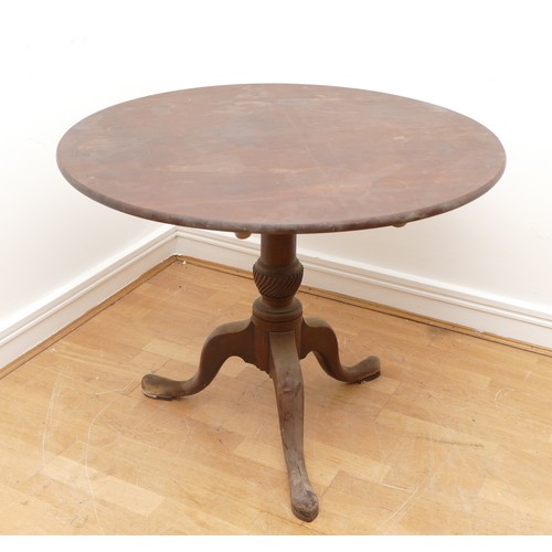 440 - A 19th century mahogany tilt top tea table, the circular top on vase turned column, with tripod cabr... 