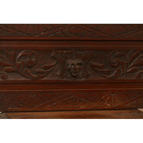 456 - An early 20th century Jacobean revival oak hall stand, the carved stepped pediment over rectangular ... 