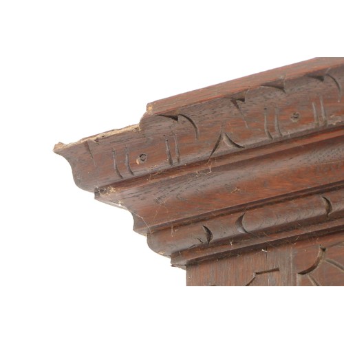 456 - An early 20th century Jacobean revival oak hall stand, the carved stepped pediment over rectangular ... 