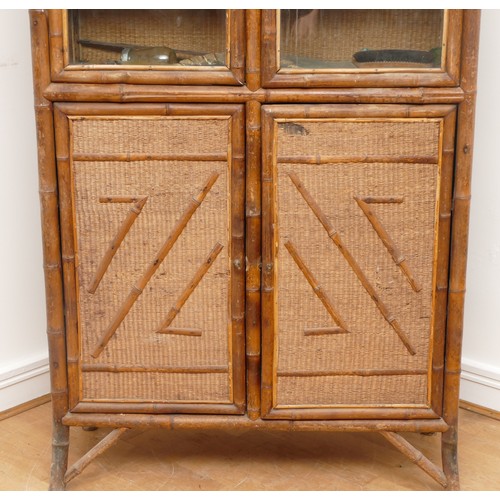 446 - An Edwardian bamboo cabinet, two glass doors over two cupboard doors, splayed legs, 92 x 190 x 35cm