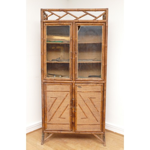 446 - An Edwardian bamboo cabinet, two glass doors over two cupboard doors, splayed legs, 92 x 190 x 35cm