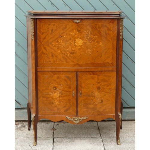 452 - A French mahogany, kingwood and boxwood inlaid drinks cabinet, the fall front with mirrored interior... 