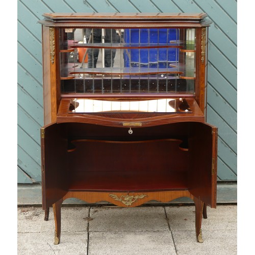 452 - A French mahogany, kingwood and boxwood inlaid drinks cabinet, the fall front with mirrored interior... 