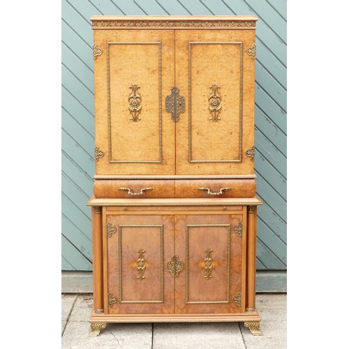 453 - An Italian burr walnut with brass applied mounts drinks cabinet, the cupboard doors opening to revea... 