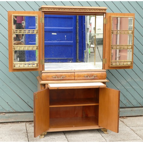 453 - An Italian burr walnut with brass applied mounts drinks cabinet, the cupboard doors opening to revea... 