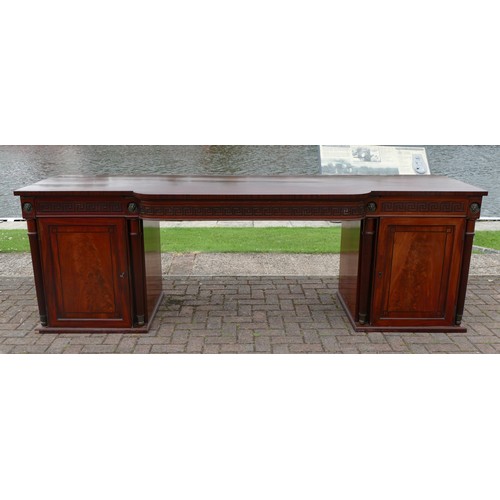 454 - An impressive Regency mahogany break front side board, with central frieze drawer with Greek Key dec... 