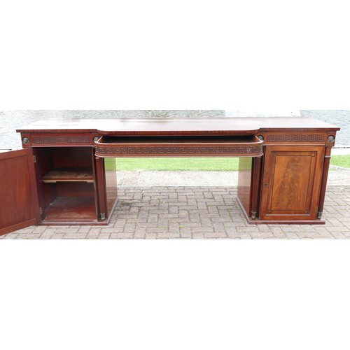 454 - An impressive Regency mahogany break front side board, with central frieze drawer with Greek Key dec... 