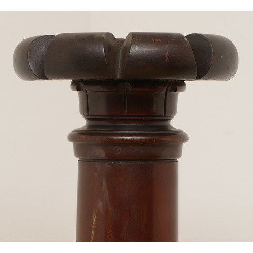 441 - A 19th century mahogany torchiere, with carved surmount, plain tapering column, 139cm